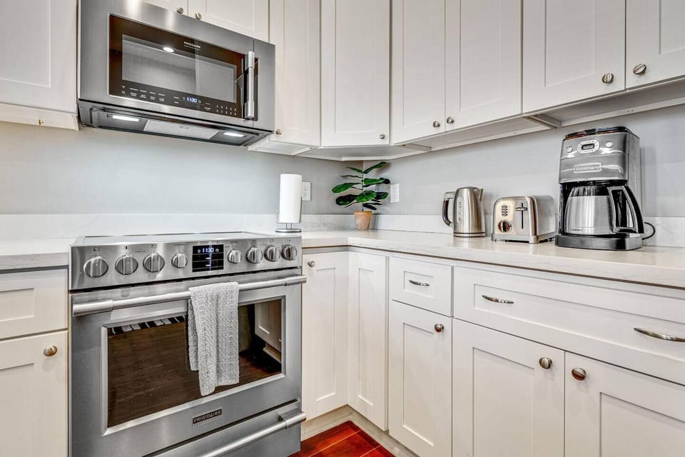 Fully stocked kitchen w/ modern appliances & ample prep space for home-cooked meals.
