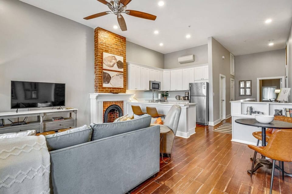 Open living, dining & kitchen space bathed in natural light w/ hardwood floors.

