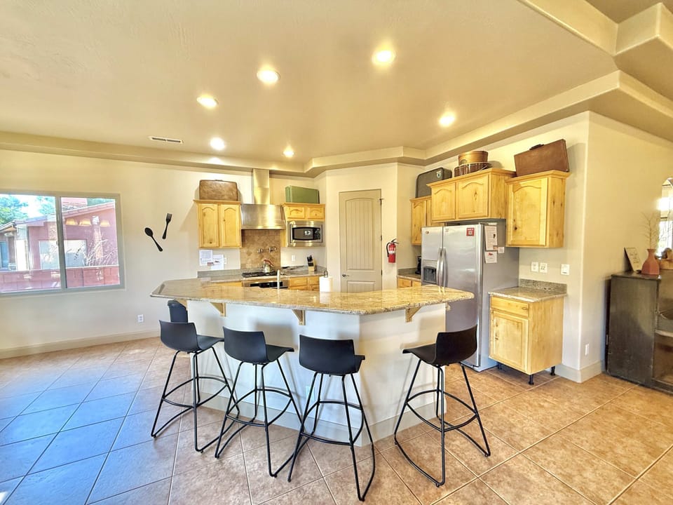 The kitchen offers additional seating at the bar
