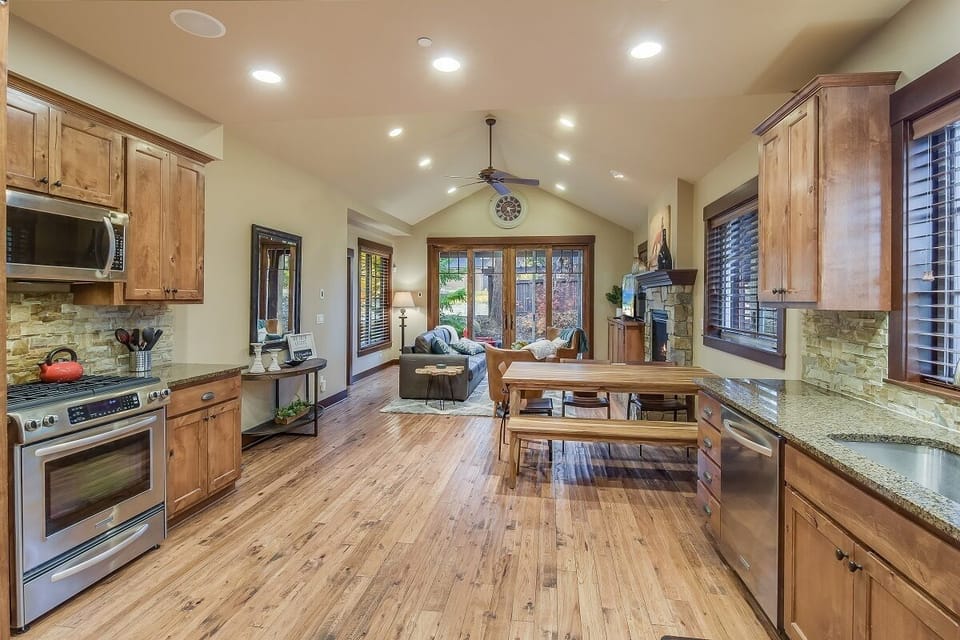 Vaulted ceilings, warm wood tones, and open-concept