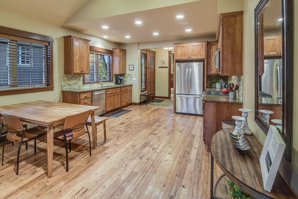 Light-filled kitchen and dining nook with custom finishes and inviting ambiance