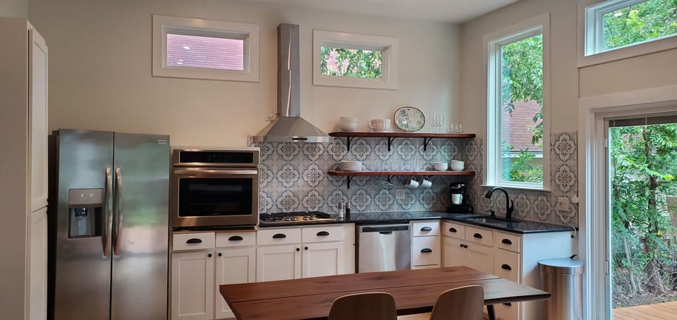 The kitchen has new amenities, gas stove and all main dishes, pots, cutlery.