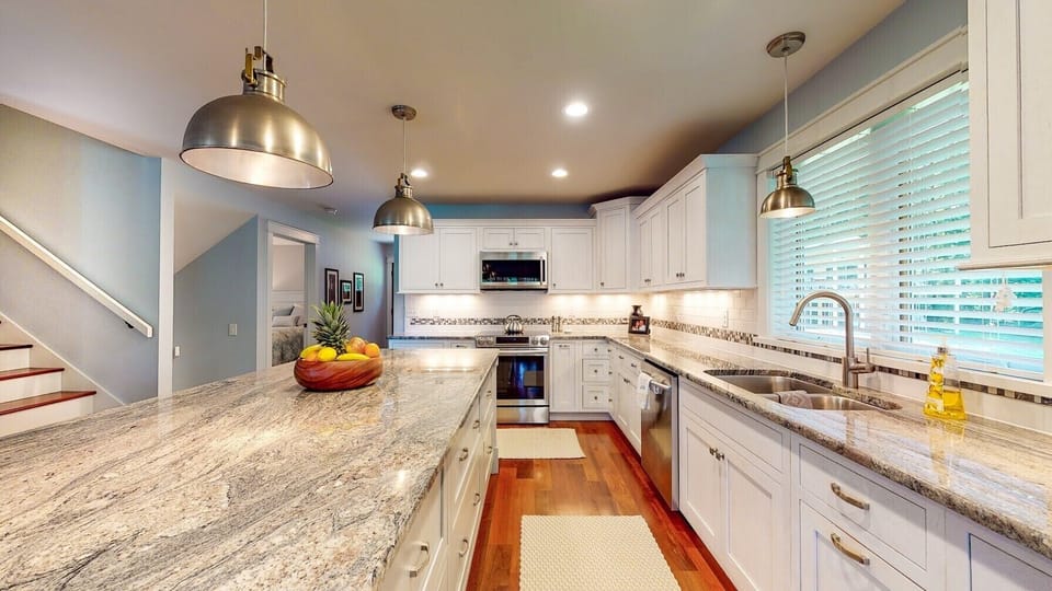Fully appointed kitchen with SS appliances and granite counters