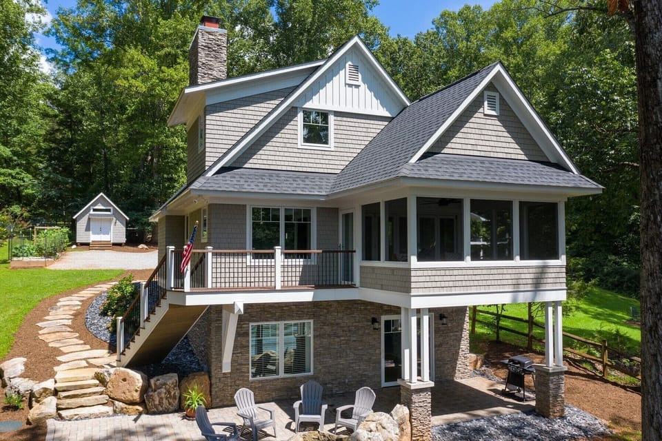 View from the lake side with cozy bunk house for extra sleeping quarters 