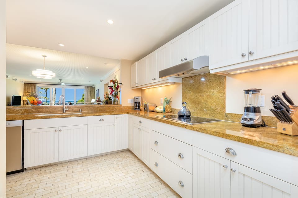 Open-concept kitchen with stainless steel appliances and plenty of natural light.