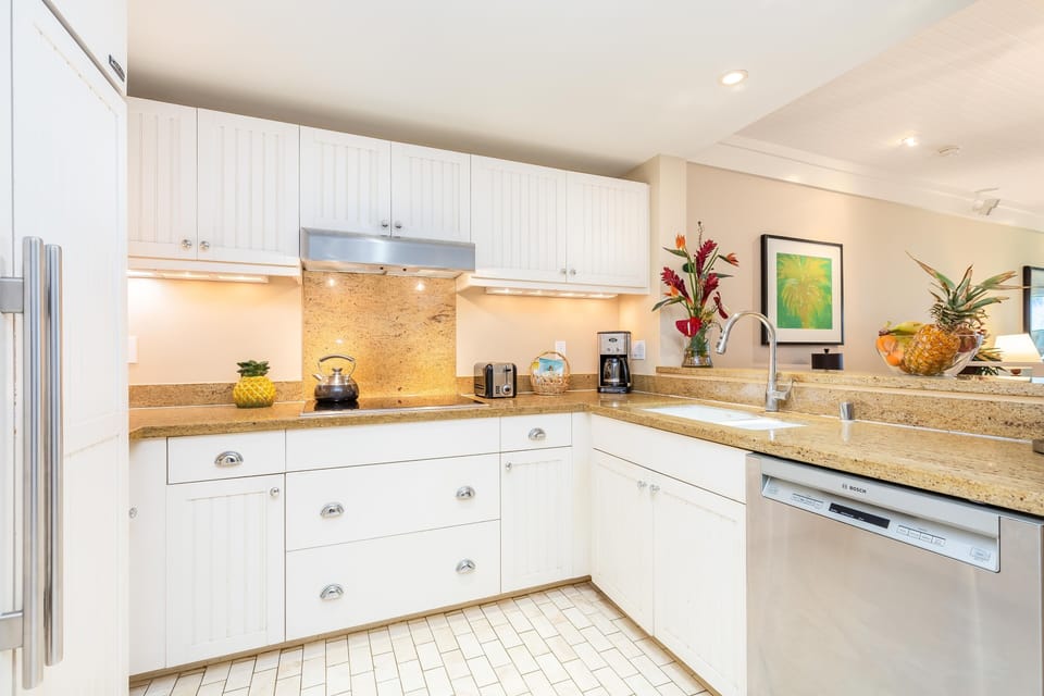 Create island-inspired dishes in the large kitchen, featuring stainless steel appliances and plenty of prep space.