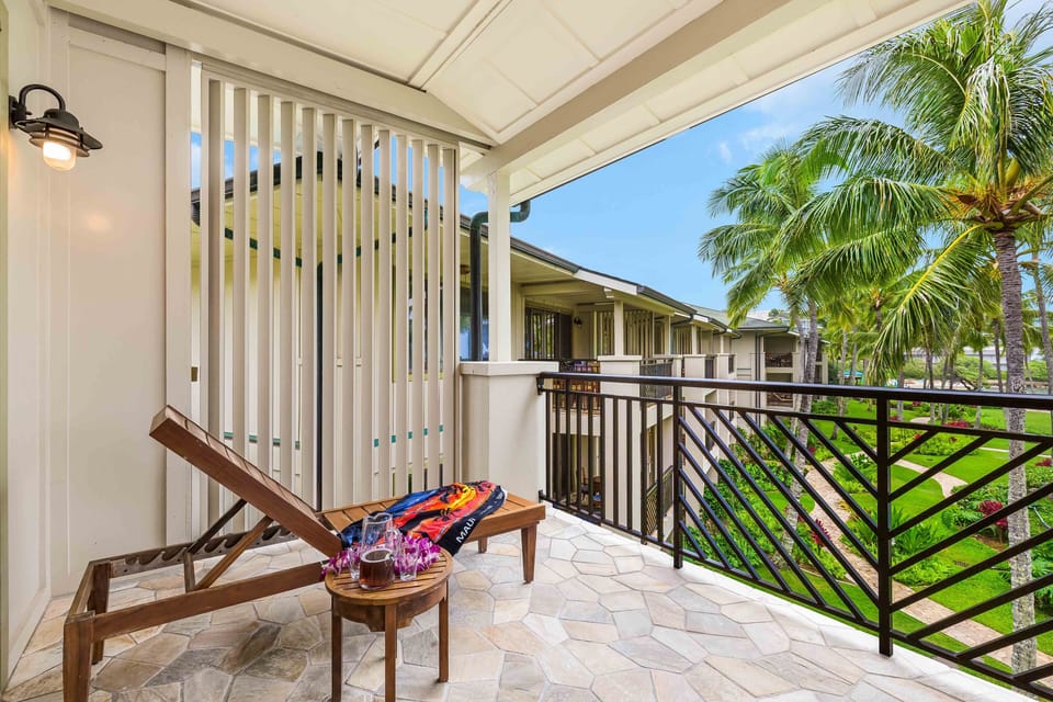 Relax in comfort while overlooking swaying palms and the sparkling Ocean Villas pool.