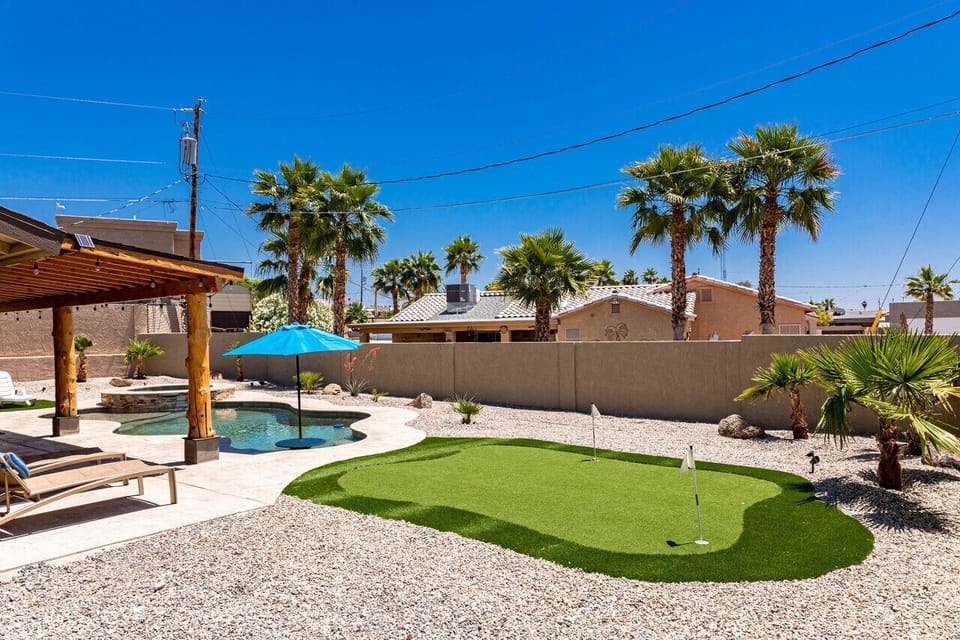Closed in backyard with pool and entertainment.