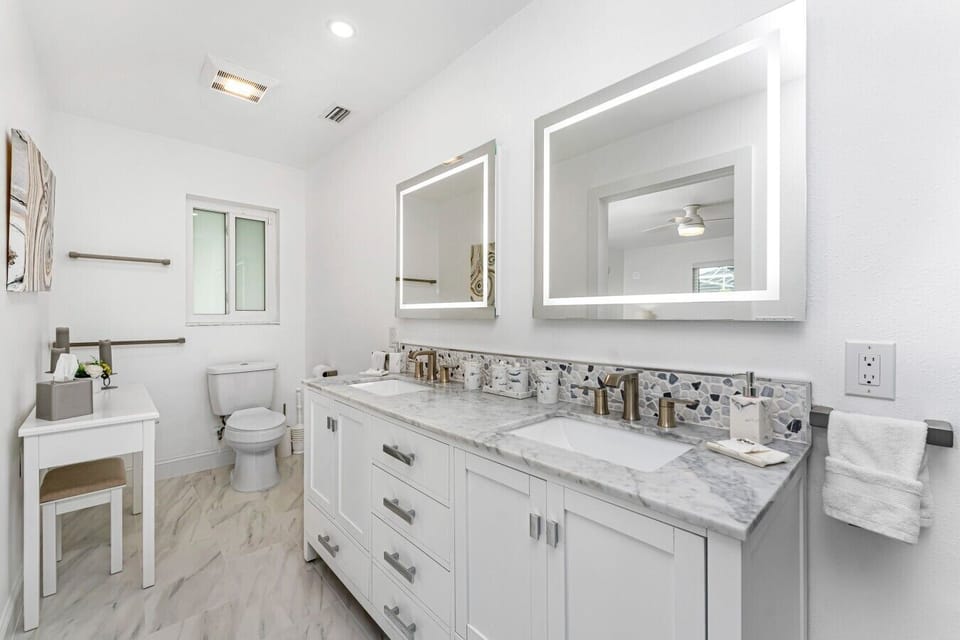 Ensuite bathroom with double vanity and walk-in shower