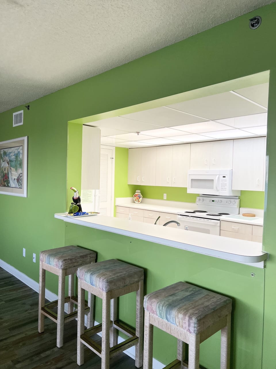Breakfast bar with a kitchen view 