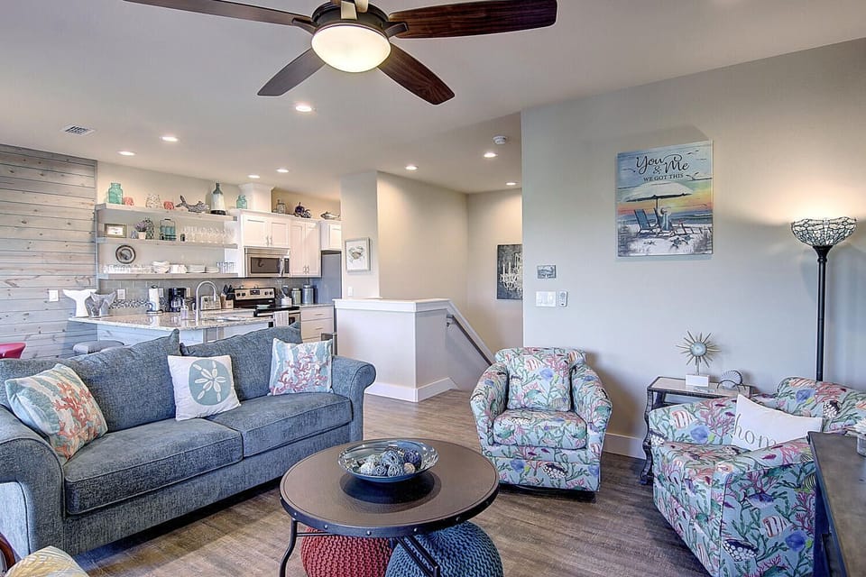 Settle into this bright coastal retreat where your open-plan living flows seamlessly to the kitchen, perfect for sharing meals and memories.