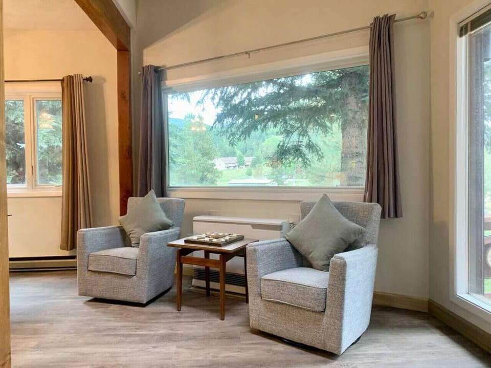 Additional seating under a large picture window