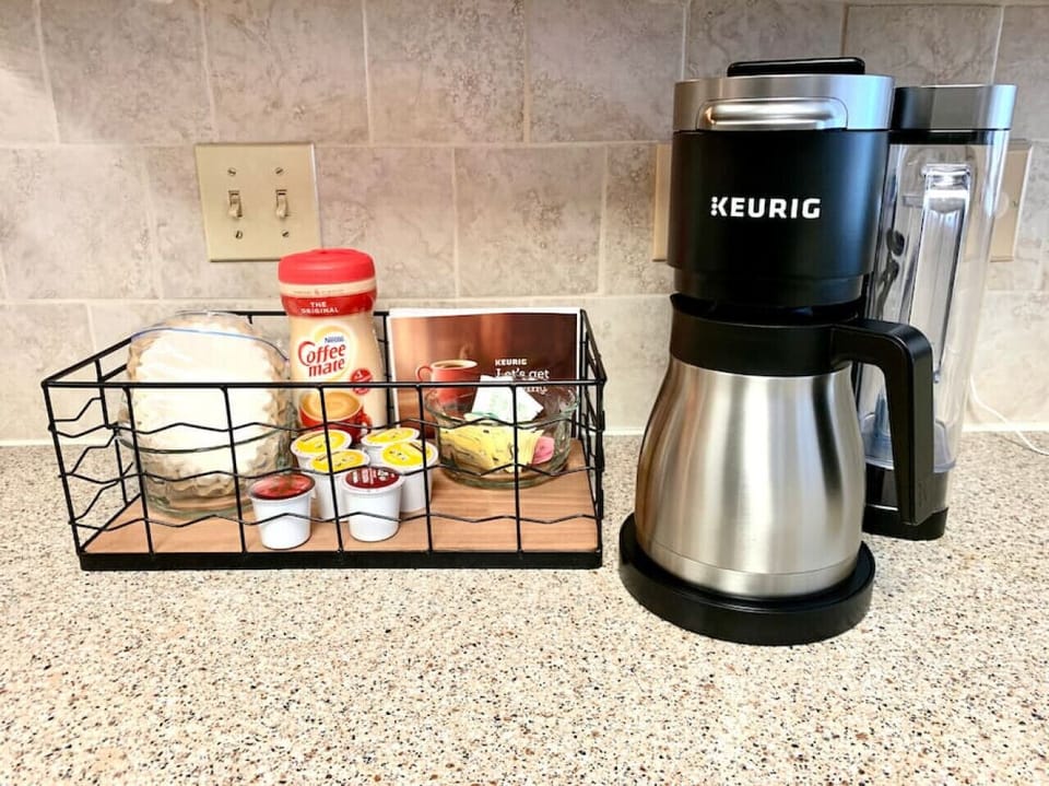 Coffee maker with filters, pods, creamer and sweeteners