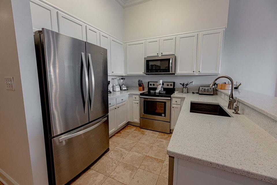 Gorgeous gourmet kitchen with white cabinetry