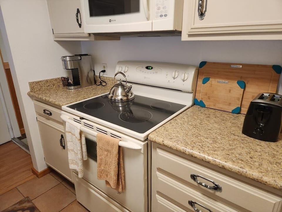 Fully stocked Kitchen including a Coffee maker, air fryer, crockpot, etc..