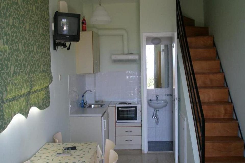 Fridge, electric kettle, cookware/dishes/utensils