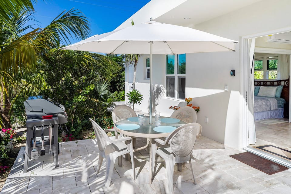 Enjoy the sunshine and ample space of a delightful garden dining area, equipped with a comprehensive BBQ set for your outdoor culinary adventures