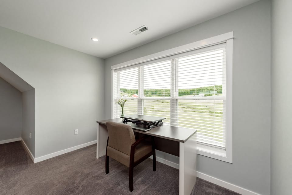 The desk in the upper level suite overlooks the golf course!