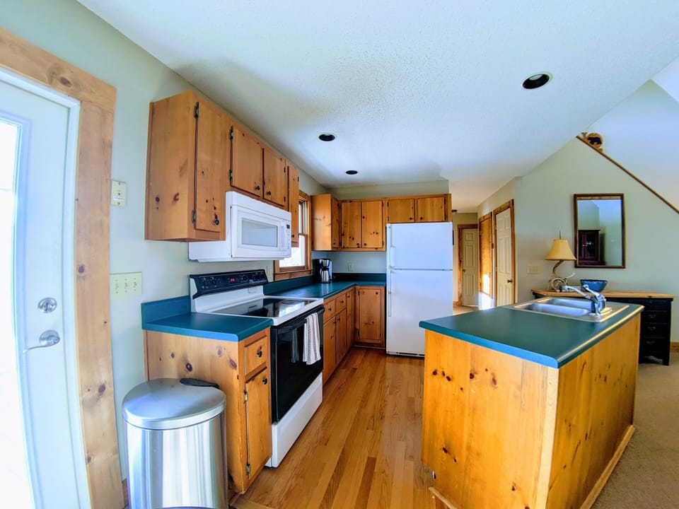 Fully stocked kitchen enables you to make delicious meals! Dining room seats 10.