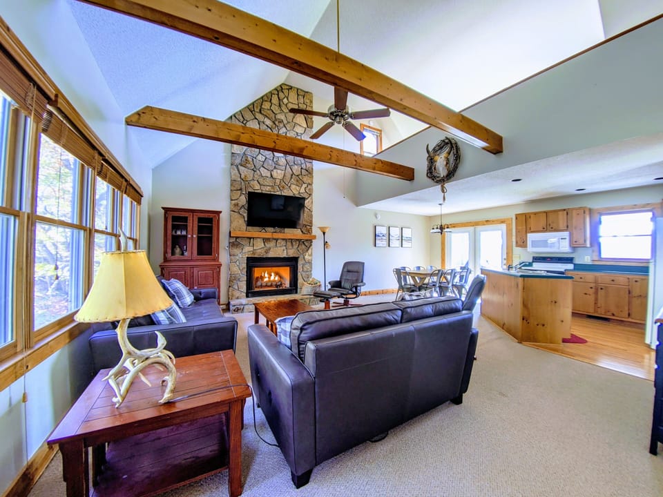 Open concept living room and kitchen. Dining room table can seat up to 10 people