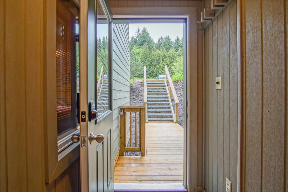 View for the condo to walkway and steps up to the parking area