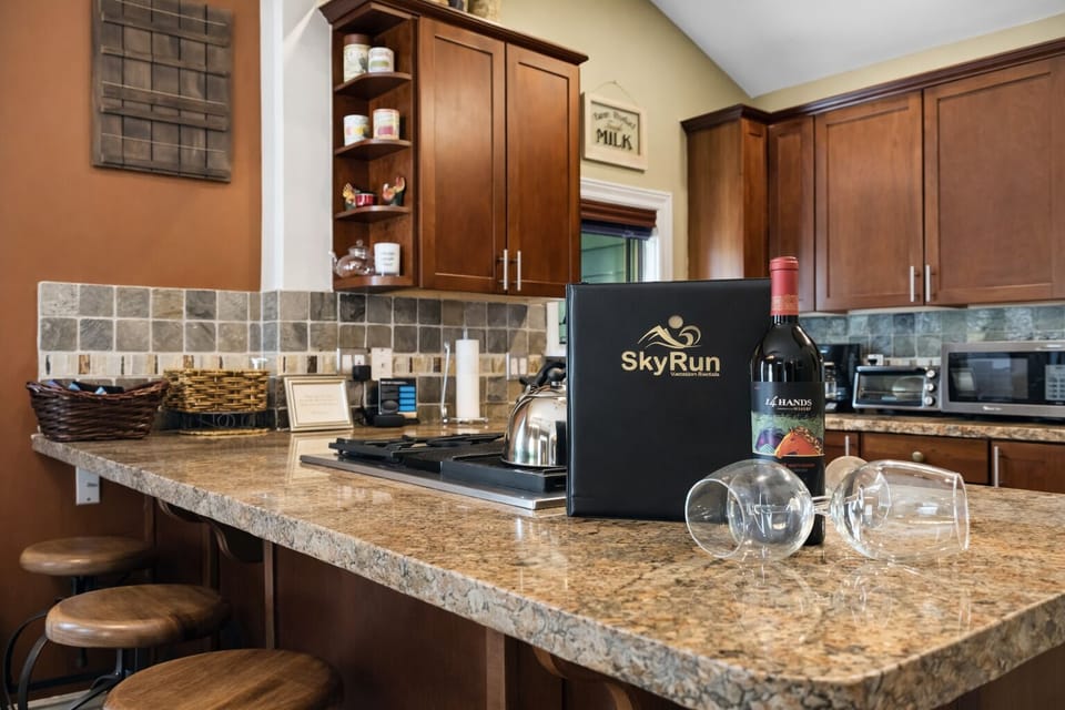 Your fully equipped kitchen features granite countertops, rich wood cabinetry, and everything needed for memorable meals together.