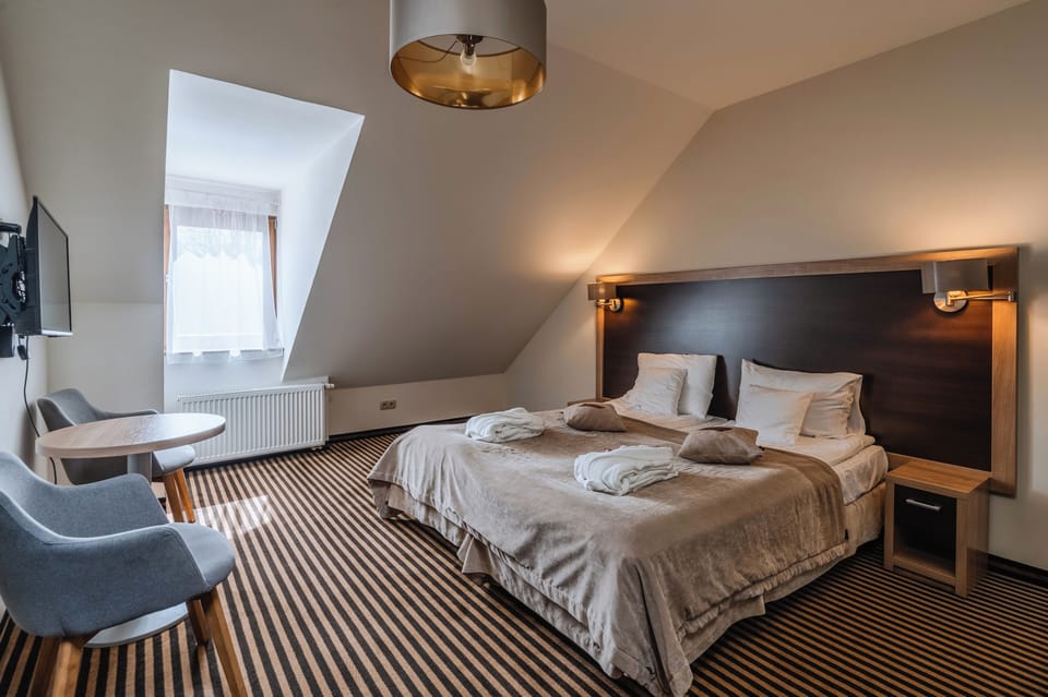 Comfort Double Room | Living area | 38-inch LCD TV with satellite channels, TV