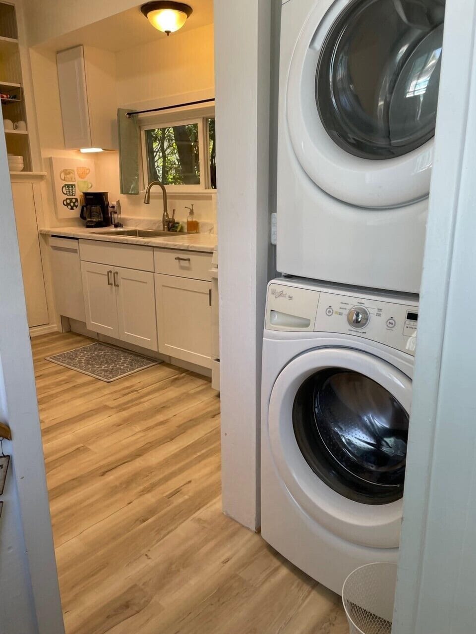 Washer and dryer adjacent to kitchen and half bath
