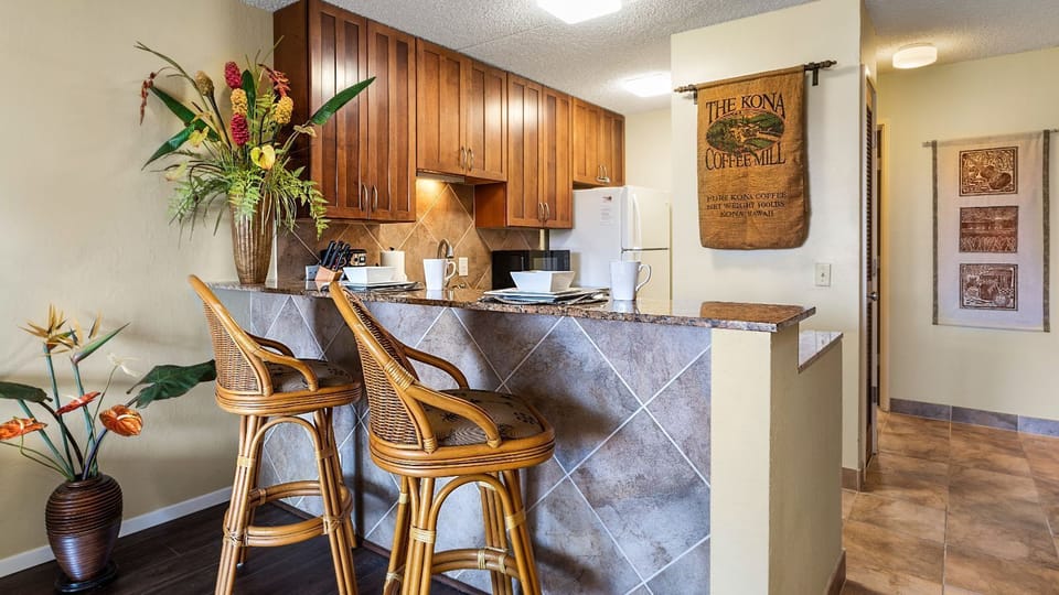 A breakfast bar and the kitchen