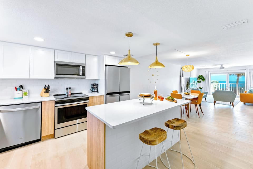 Sleek, contemporary kitchen with stainless steel appliances and a spacious island