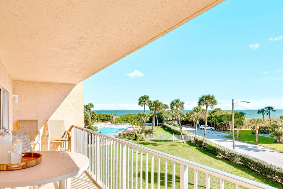 Private balcony with a seating area, perfect for enjoying ocean breezes and scenic views