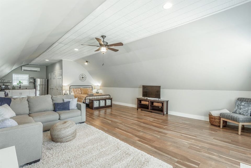 Open concept living room, kitchen, and bedroom.