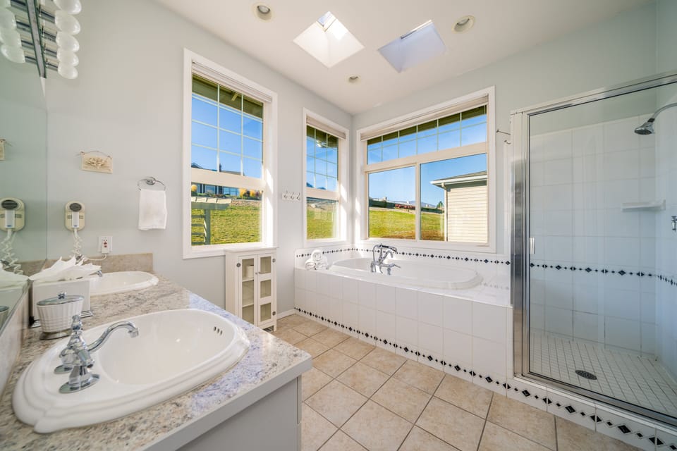 Master Bath with Jacuzzi tub, double sinks, shower & walk-in closet
