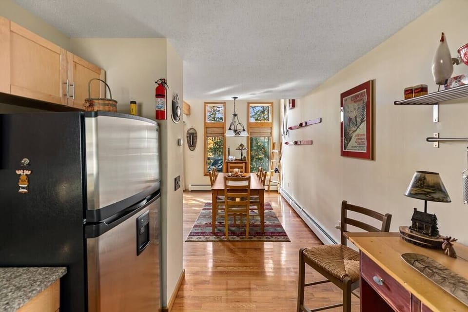 Updated kitchen with stainless steel appliances and granite countertops.