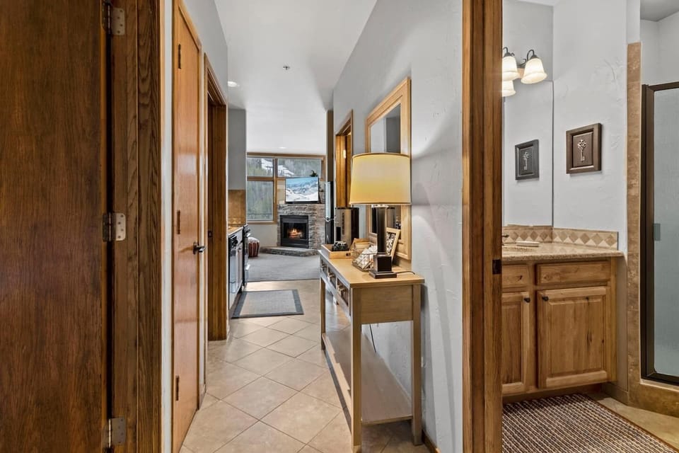 Hallway view looking past the master bathroom and coffee bar