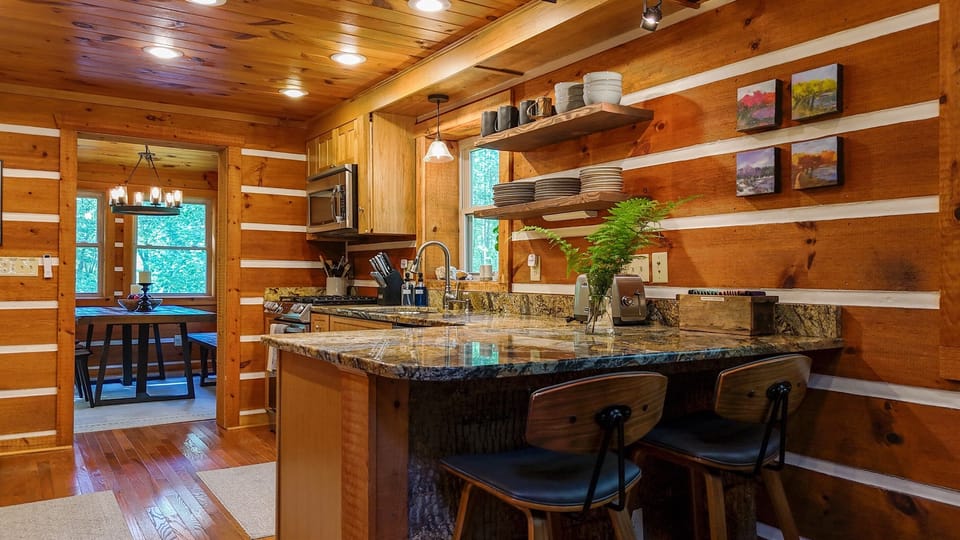 Feel right at home in our fully stocked kitchen - pots, pans, spices, and more are ready for you to whip up meals and make memories together in the kitchen at Hemlock Hill Cabin.