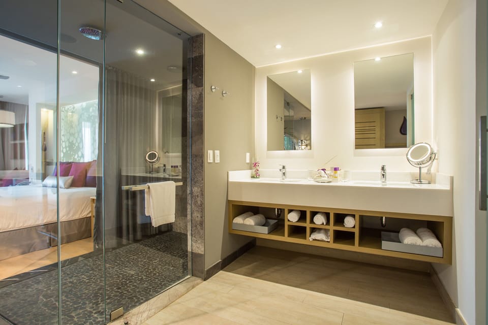 Shower, designer toiletries, hair dryer, bathrobes
