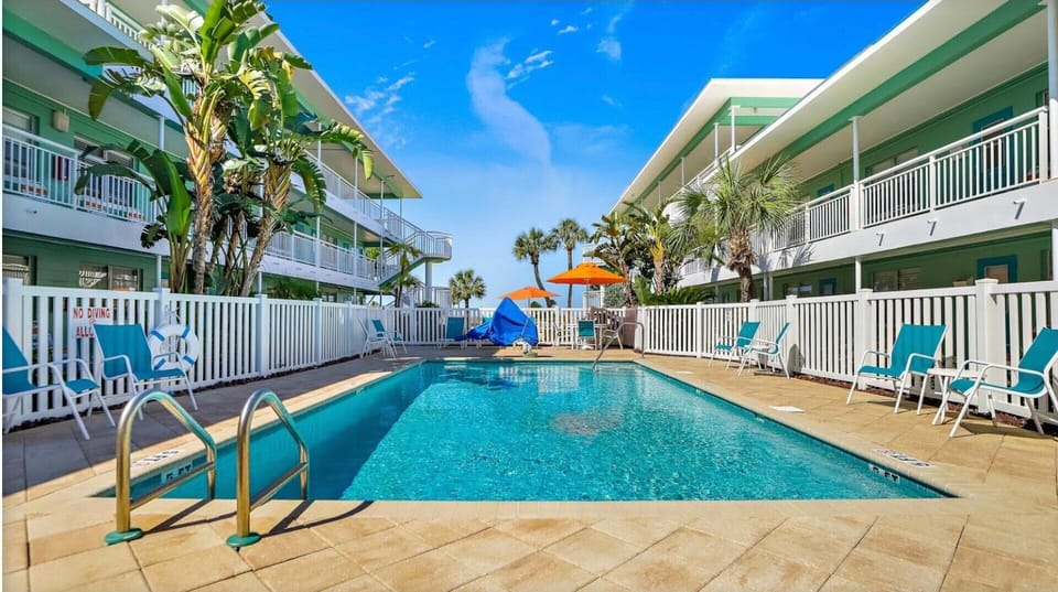 Step out your door to the heated pool or take the private path to the sugar-white sands of Treasure Island—with no stairs to climb and no roads to cross.