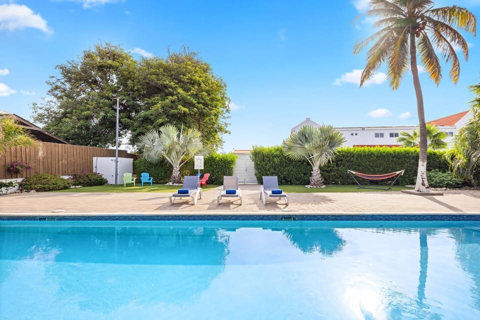 Relax in the private pool, located just behind the property.