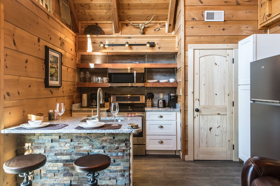 Enjoy your meals on the granite peninsula and antique style bar stools.