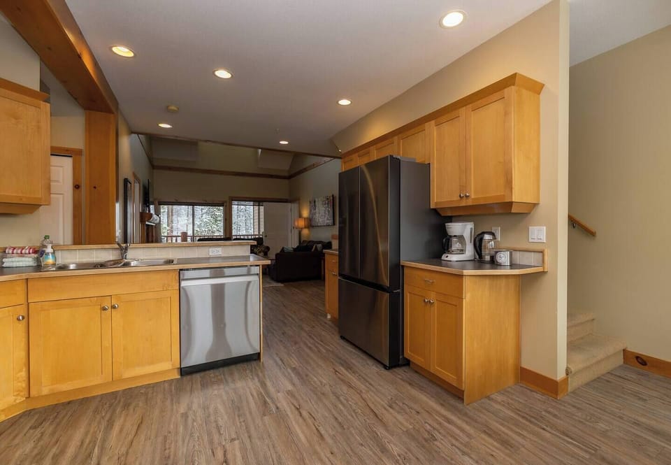 KR411 kitchen with stairs leading up to loft and 3rd bedroom. 