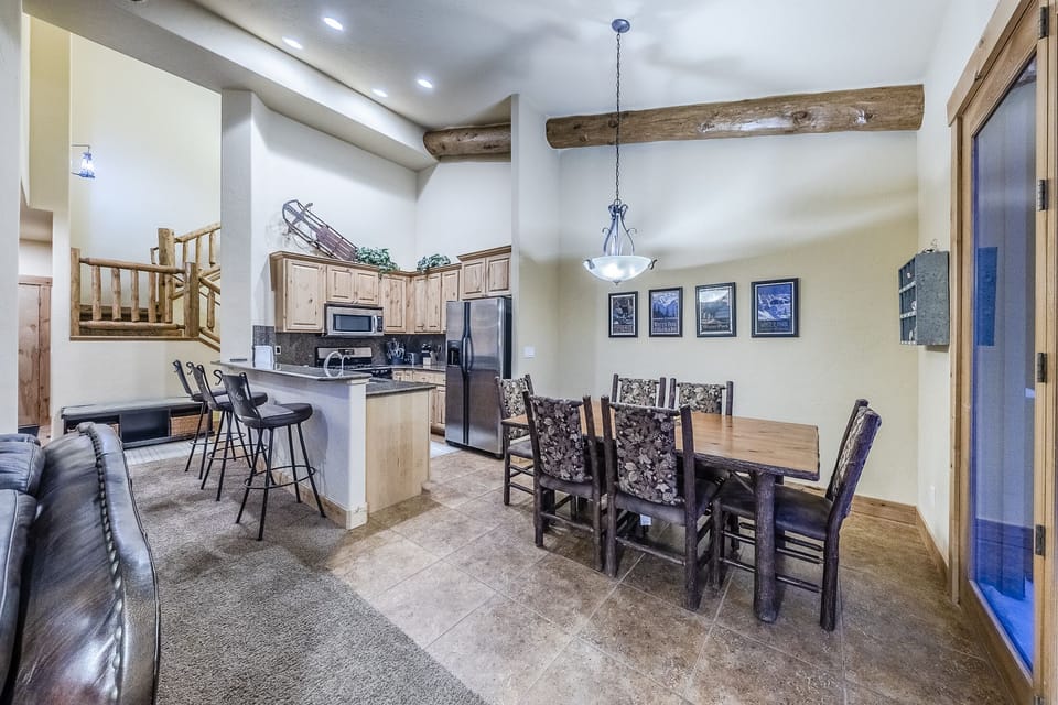 Dining Area & Kitchen - Dining table with seating for six.  Three chair bar area off the kitchen.