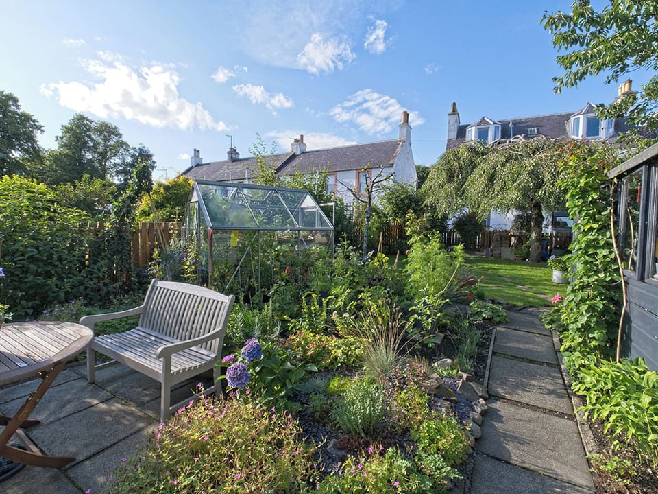 Private patio and seating area to enjoy the garden. | Lower Canterbury House, Gattonside, near Melrose