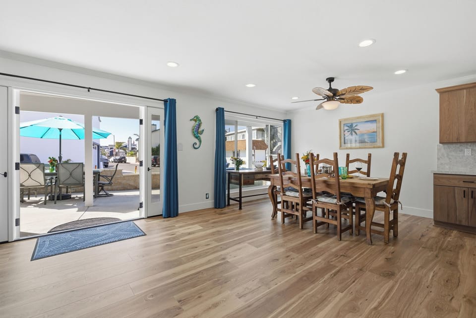 French doors open directly to the beach-view patio, creating a seamless indoor-outdoor space for dining, relaxing, and enjoying the coastal breeze.