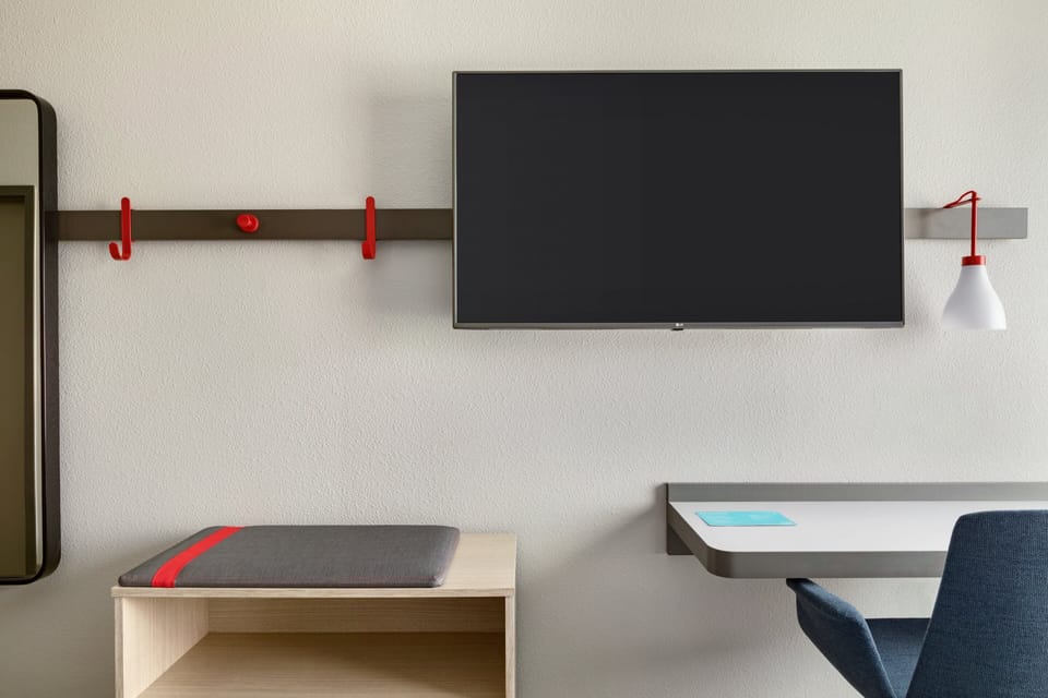 Desk, laptop workspace, blackout drapes, iron/ironing board