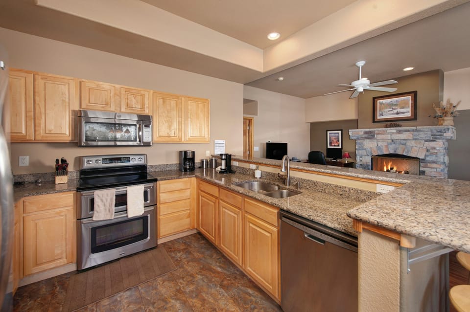 Full kitchen with stainless steel appliances on the main level.