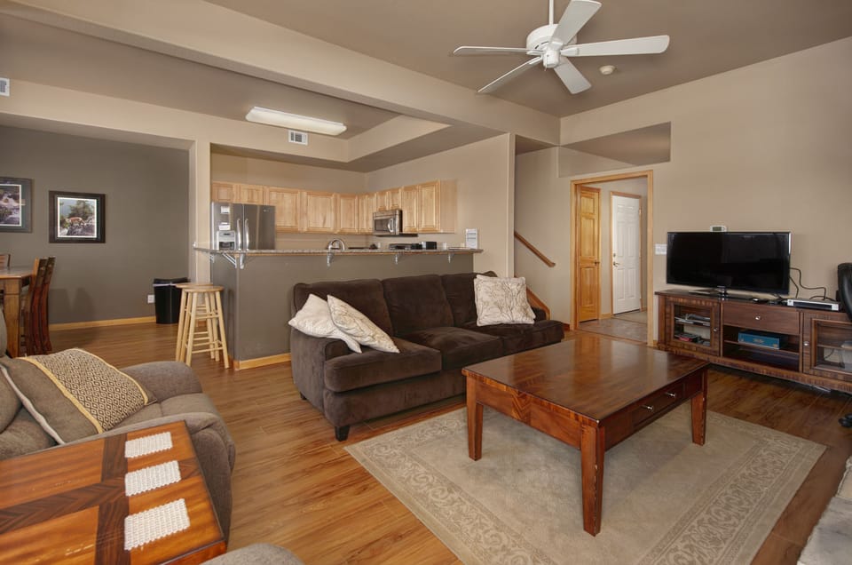 Main level living area with smart TV and gas fireplace.