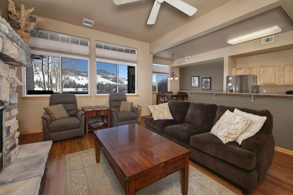 Main level living area with smart TV and gas fireplace.