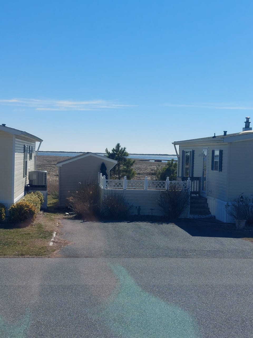 Bay views from front steps, patio and living room area.
