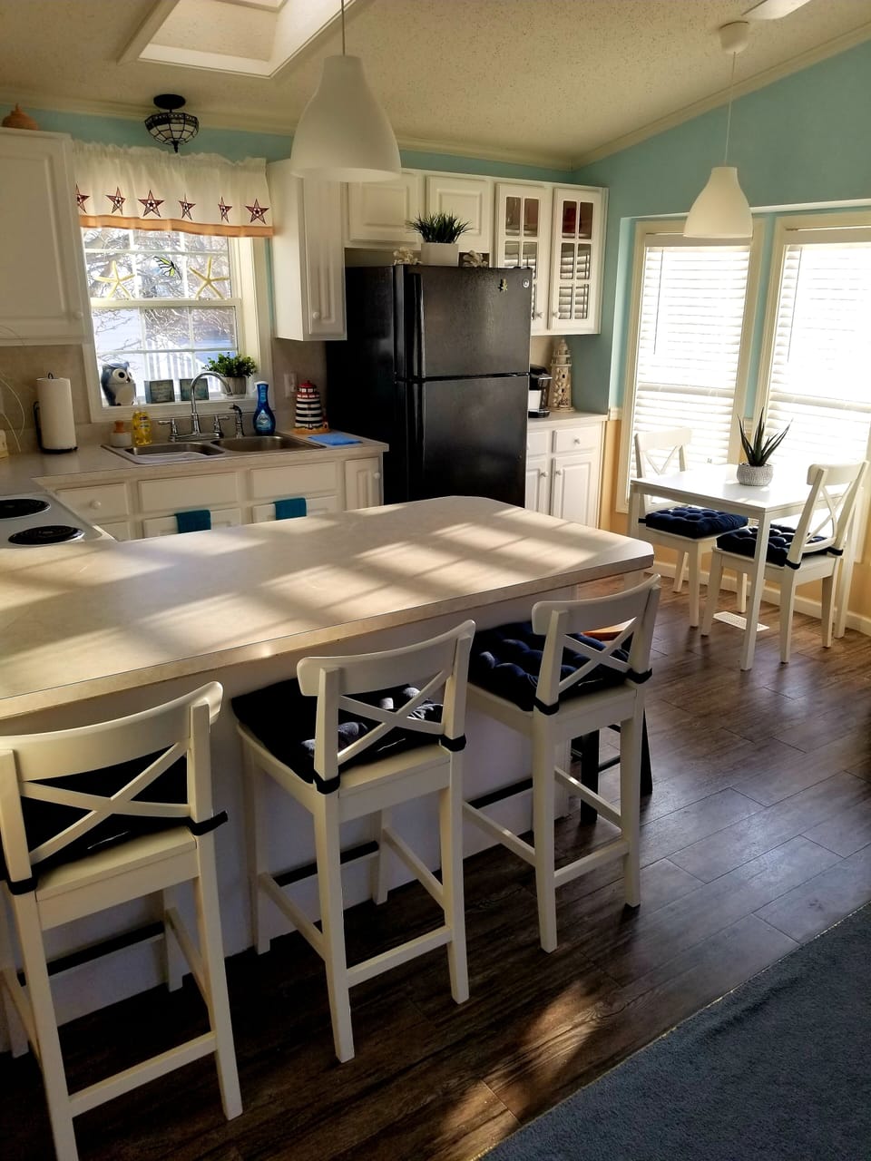 Full kitchen with plenty of seating.